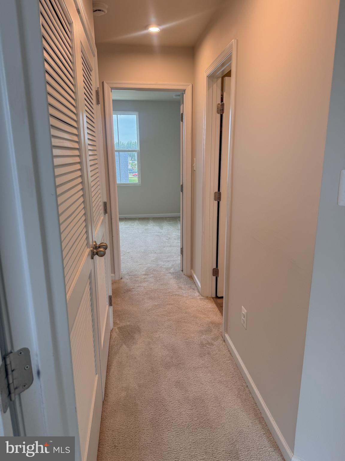 18240 Capital Court Ruther Glen, VA 22546 - Photo 19 of 29 upstairs hallway, with laundry room the the left