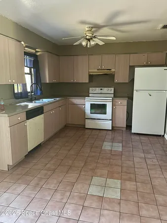 a view of an empty room and wooden floor