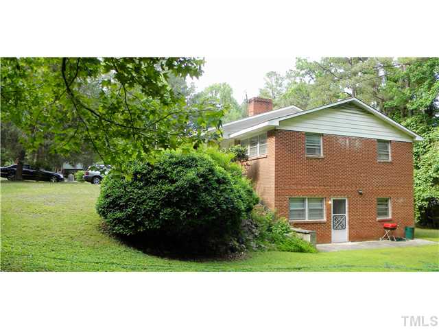 1426 Trinity Circle Raleigh, NC 27607 - Photo 2 of 12 Close up photo showing the seperate entrance to apartment suite located in the basement which includes 2 bedrooms, family room, full bath, and kitchen. 2 car garage which is unfinished is located on the back entrance of house on other side of home.
