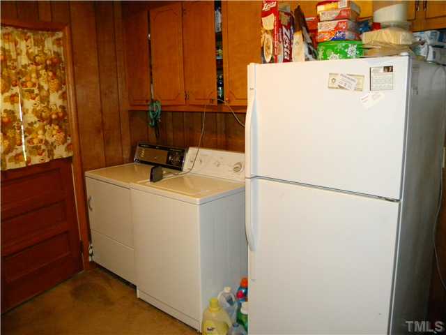 1426 Trinity Circle Raleigh, NC 27607 - Photo 7 of 12 Washer, Dryer, refrigerator but does not have a dishwasher in kitchen. The seperate apartment suite in basement includes a seperate refrigerator, small washer and dryer.