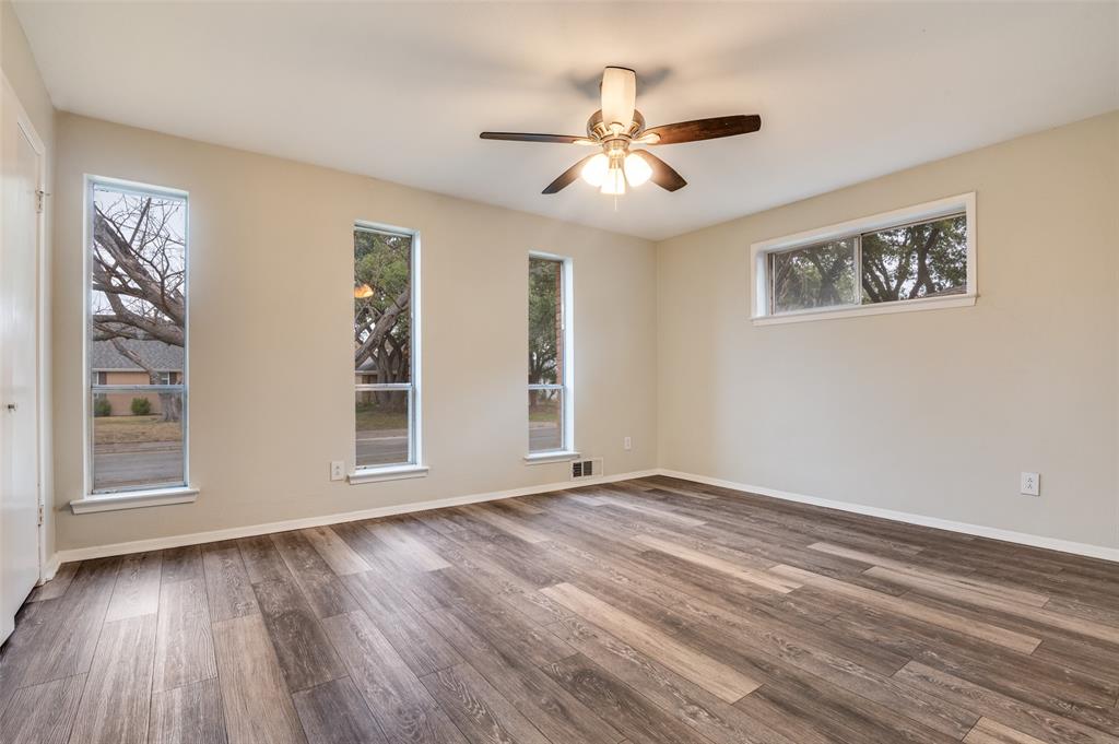2244 Homeway Circle Dallas, TX 75228 - Photo 9 of 12 Spare room with wood finished floors and a ceiling fan