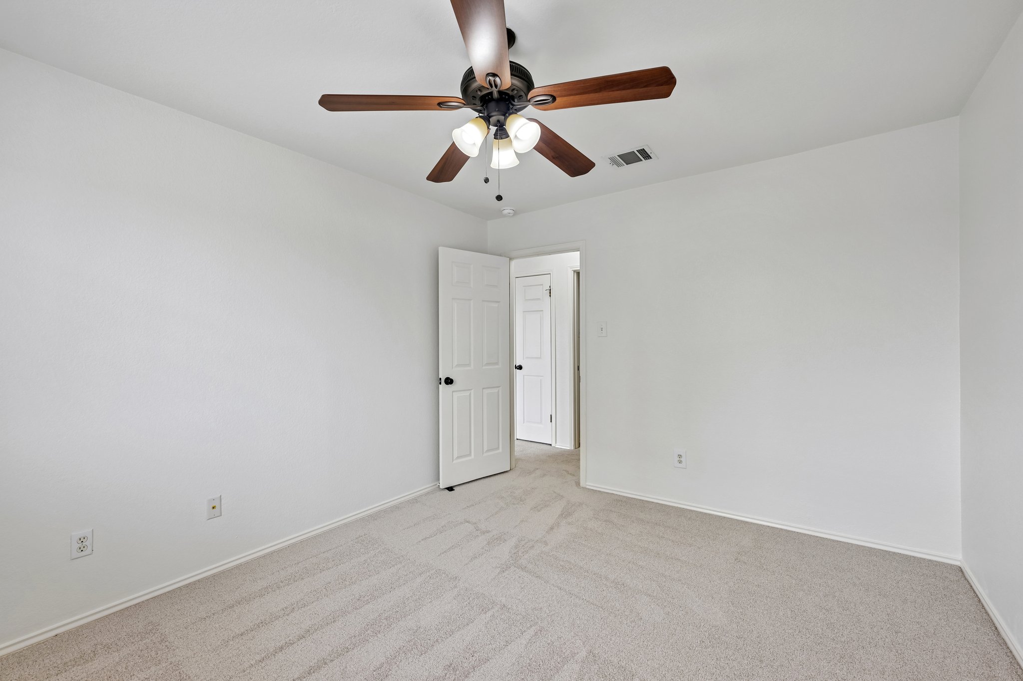 4100 Mocha Trail Austin, TX 78728 - Photo 22 of 33 A quiet retreat with comfortable carpet flooring and an overhead ceiling fan for optimal airflow.