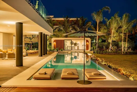 a view of swimming pool with outdoor seating