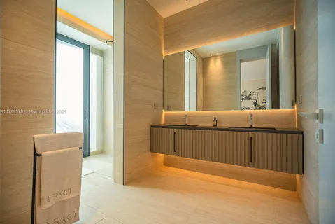 a view of a bedroom with furniture and window