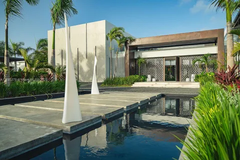 a swimming pool with outdoor seating and yard