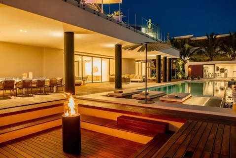 a front view of a house with a street