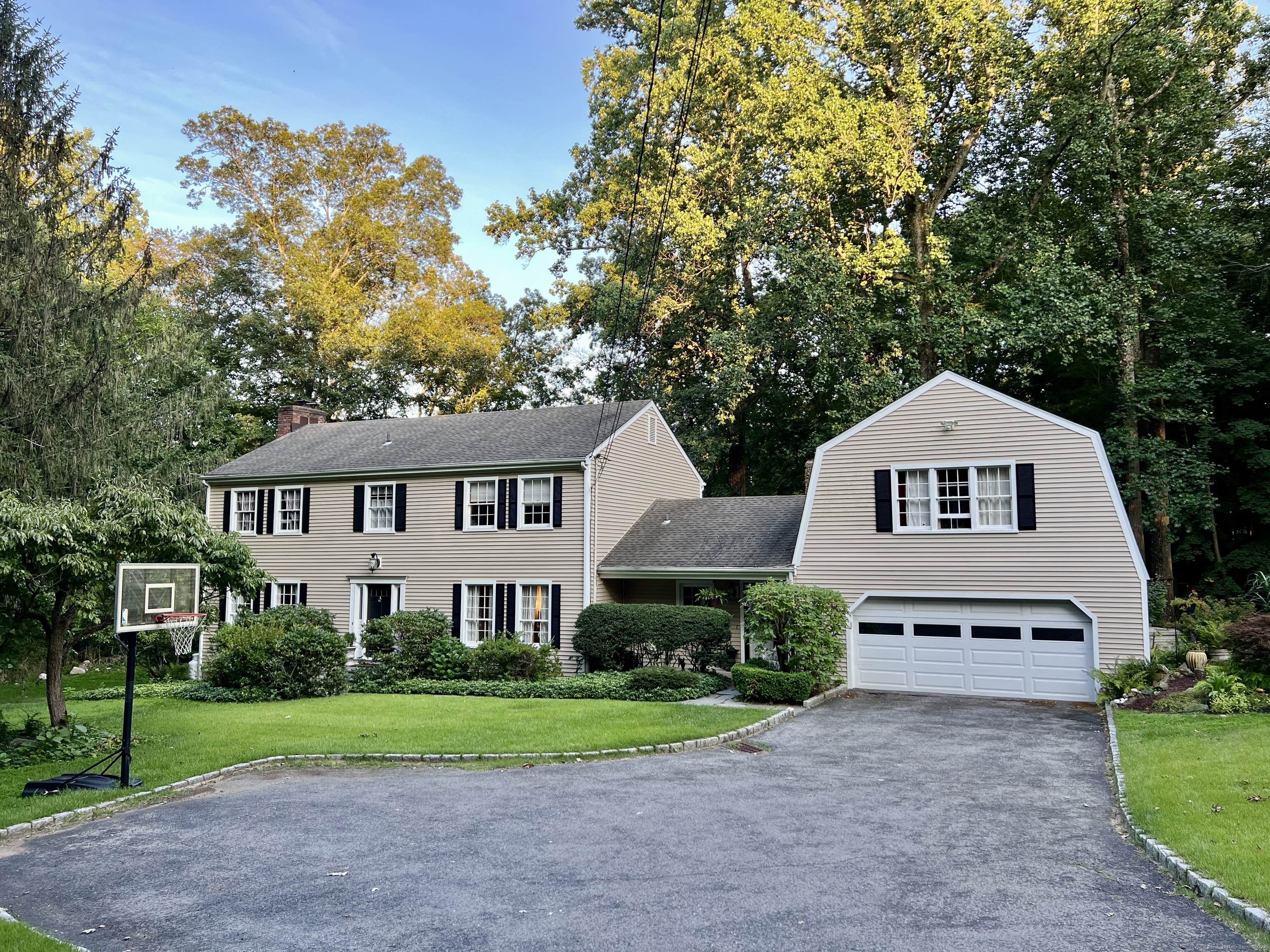 116 Maywood Road Norwalk, CT 06850 - Photo 1 of 1 a front view of a house with a yard and garage