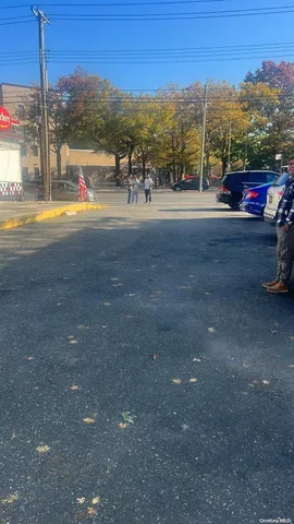 a view of street with parked cars