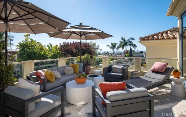 a outdoor space with patio the couches and a umbrella