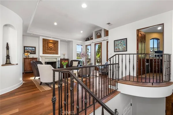 a bedroom with a bed and a flat tv screen on dresser