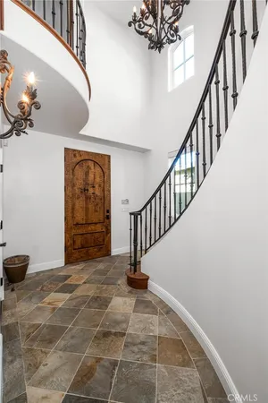 a bathroom with a granite countertop tub sink and mirror