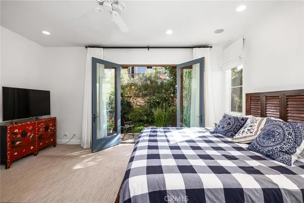 a spacious bathroom with a tub double vanity sink and a mirror