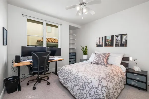 a en suite bathroom with a sink a large mirror and a shower