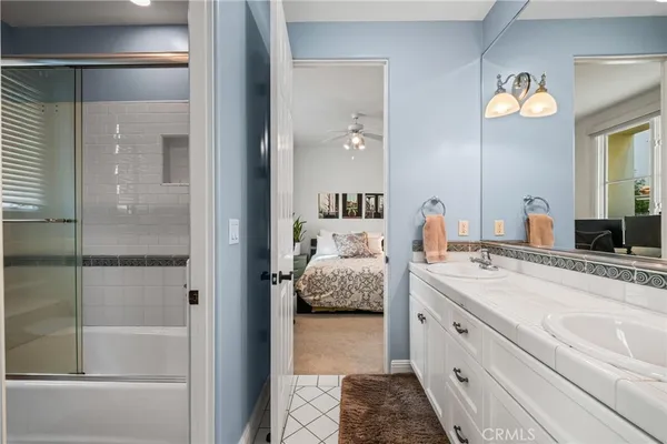 a bedroom with furniture and a flat screen tv
