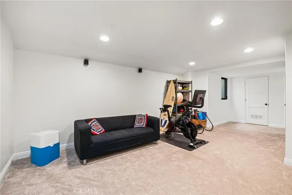a view of a patio with table and chairs with wooden floor and fence