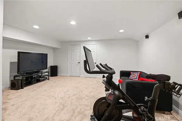 a living room with furniture a rug and a chandelier