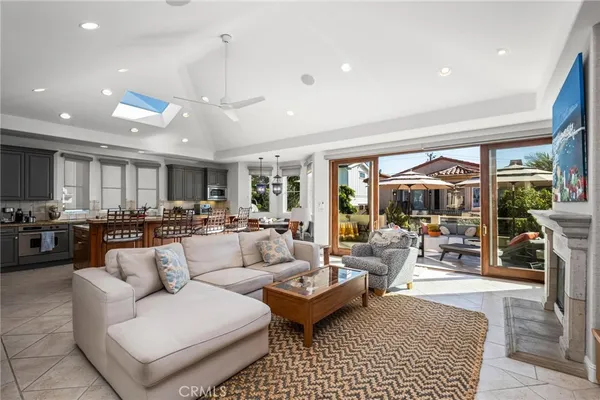 a living room with fireplace furniture and a flat screen tv