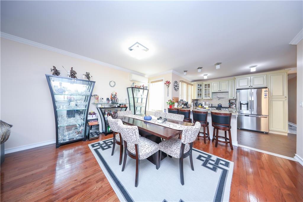 196 Quentin Road Brooklyn, NY 11223 - Photo 11 of 29 a view of a dining room with furniture wooden floor and next to a window