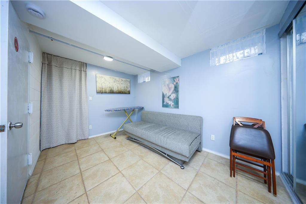 196 Quentin Road Brooklyn, NY 11223 - Photo 16 of 29 a living room with furniture