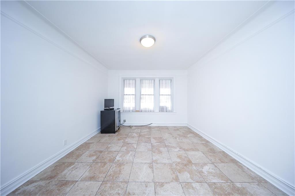196 Quentin Road Brooklyn, NY 11223 - Photo 21 of 29 an empty room with windows