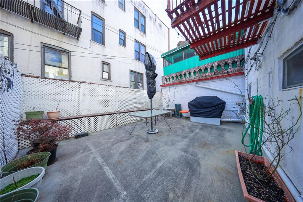 196 Quentin Road Brooklyn, NY 11223 - Photo 24 of 29 a view of a street with potted plants