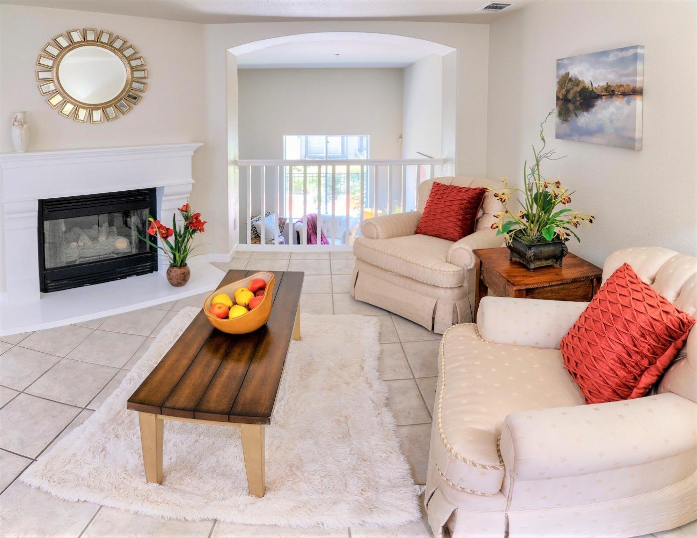 3111 White Riesling Place San Jose, CA 95135 - Photo 11 of 24 a living room with furniture and a fireplace