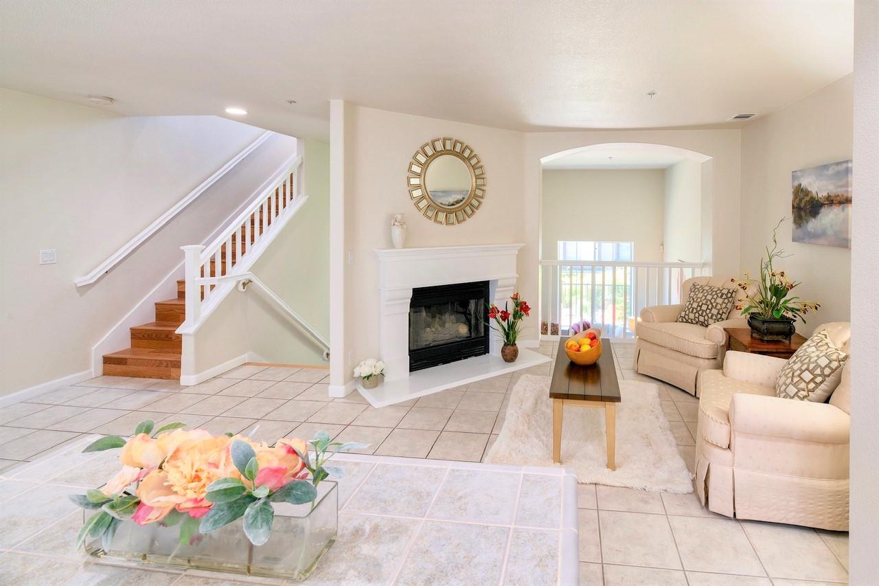 3111 White Riesling Place San Jose, CA 95135 - Photo 12 of 24 a living room with furniture and a fireplace