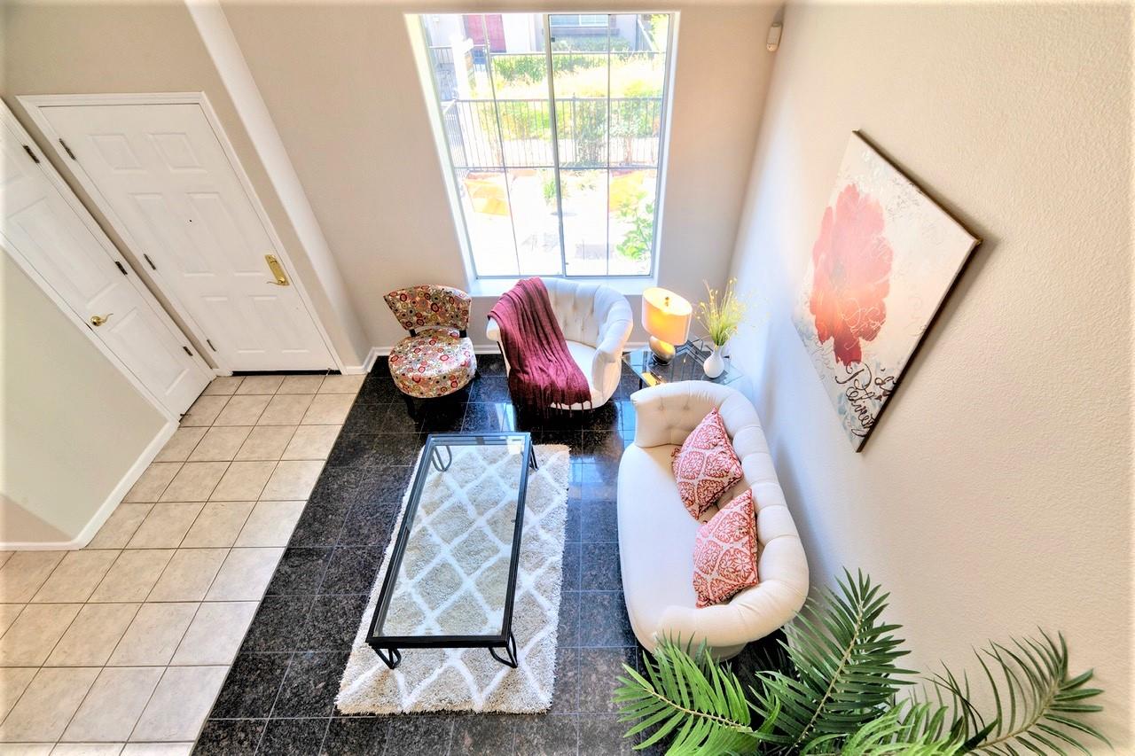 3111 White Riesling Place San Jose, CA 95135 - Photo 13 of 24 a living room with furniture and a floor to ceiling window