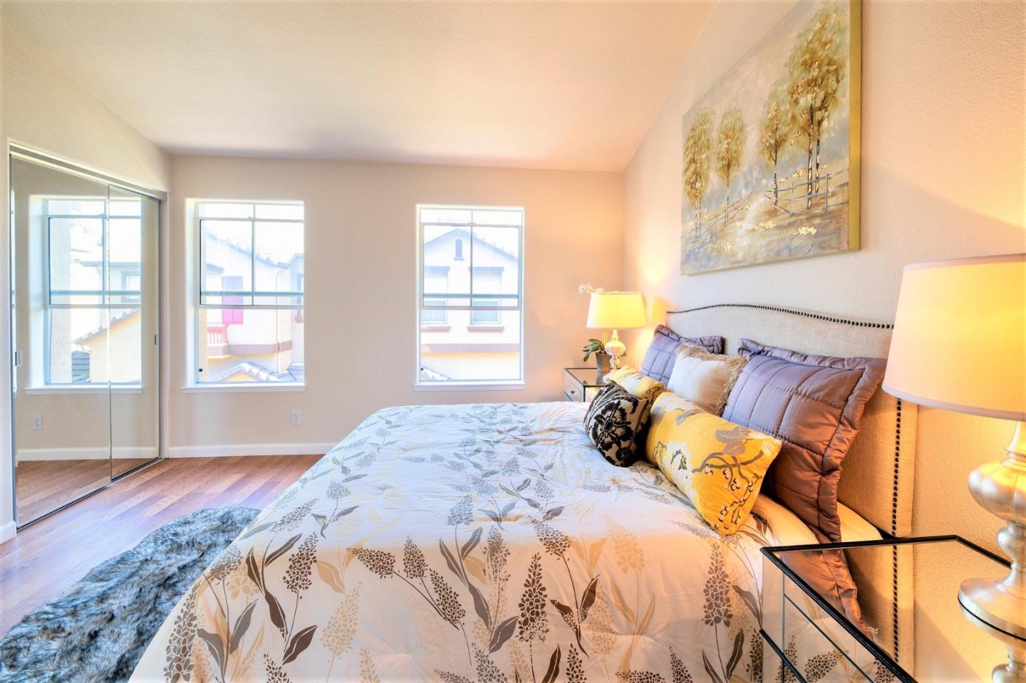 3111 White Riesling Place San Jose, CA 95135 - Photo 15 of 24 a bedroom with a bed and wooden floor