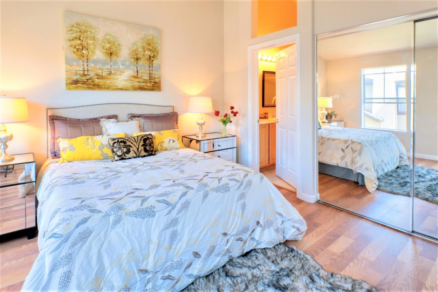 3111 White Riesling Place San Jose, CA 95135 - Photo 16 of 24 a bedroom with a bed and wooden floor