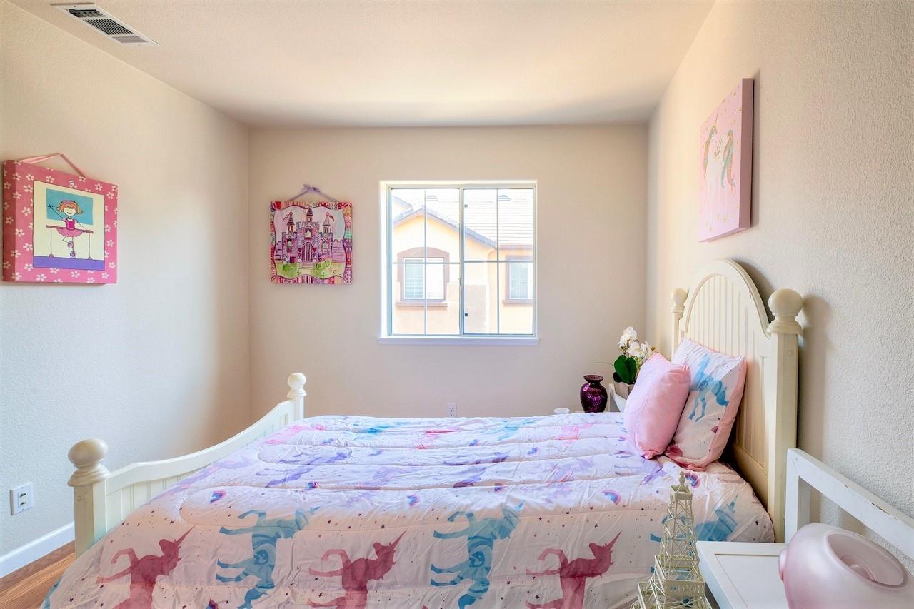 3111 White Riesling Place San Jose, CA 95135 - Photo 19 of 24 a bedroom with a bed and a window