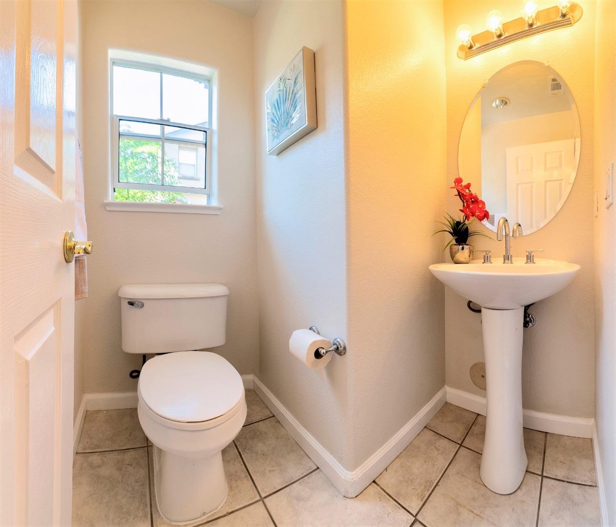 3111 White Riesling Place San Jose, CA 95135 - Photo 6 of 24 a bathroom with a sink mirror toilet and next to a window