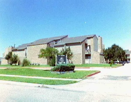 a front view of a house with a yard table and chairs