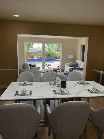 a kitchen with granite countertop a stove and a refrigerator