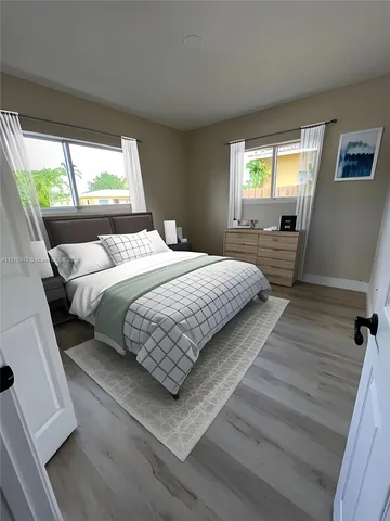 a view of swimming pool with an outdoor seating