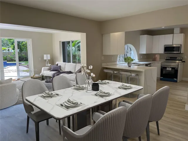 a view of a dining room with furniture