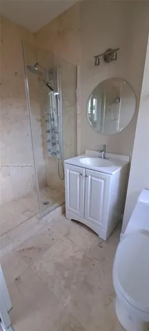 a kitchen with stainless steel appliances sink a stove and cabinets