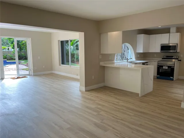 a bathroom with a toilet and a tub