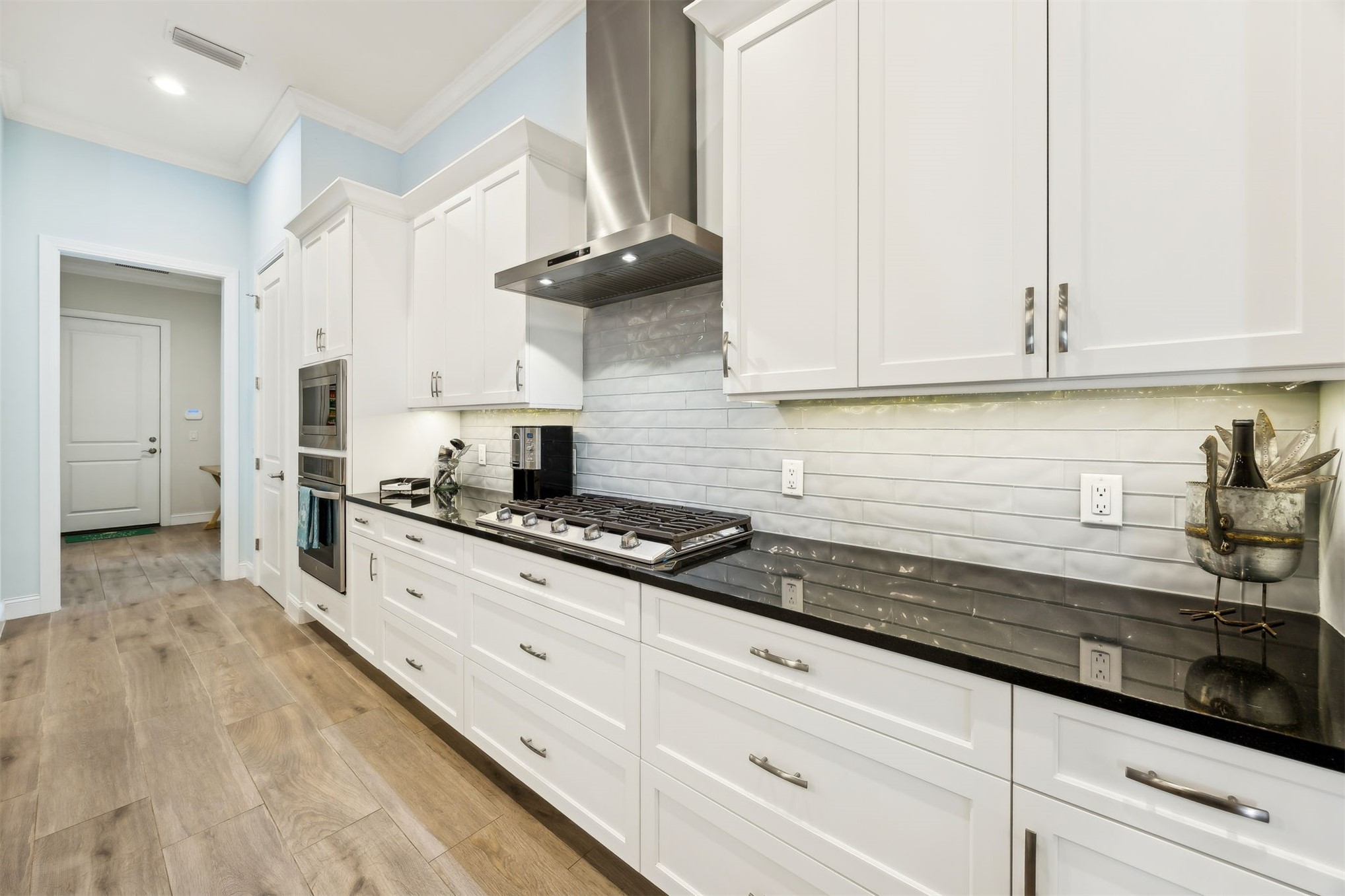 96029 Brady Point Road Fernandina Beach, FL 32034 - Photo 12 of 61 a kitchen with granite countertop white cabinets and stainless steel appliances