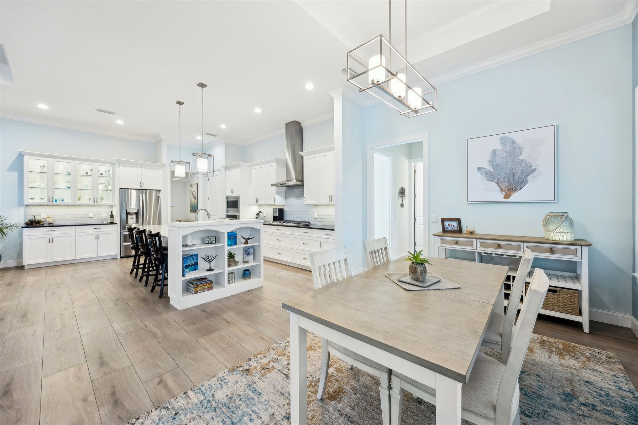 96029 Brady Point Road Fernandina Beach, FL 32034 - Photo 19 of 61 a kitchen with stainless steel appliances a dining table chairs and stove