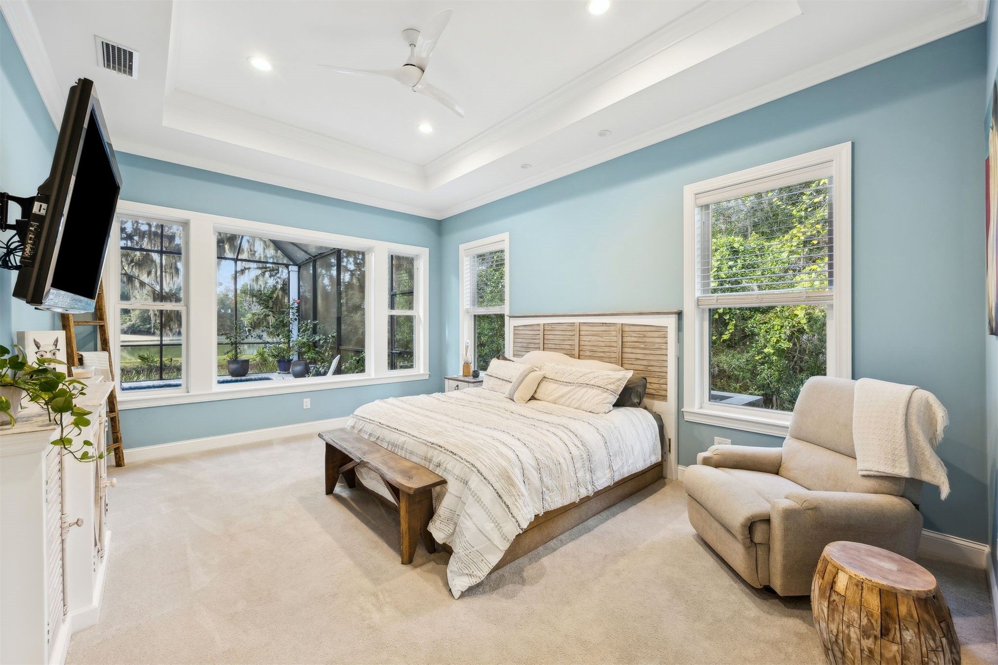 96029 Brady Point Road Fernandina Beach, FL 32034 - Photo 20 of 61 a spacious bedroom with a large bed and a large window