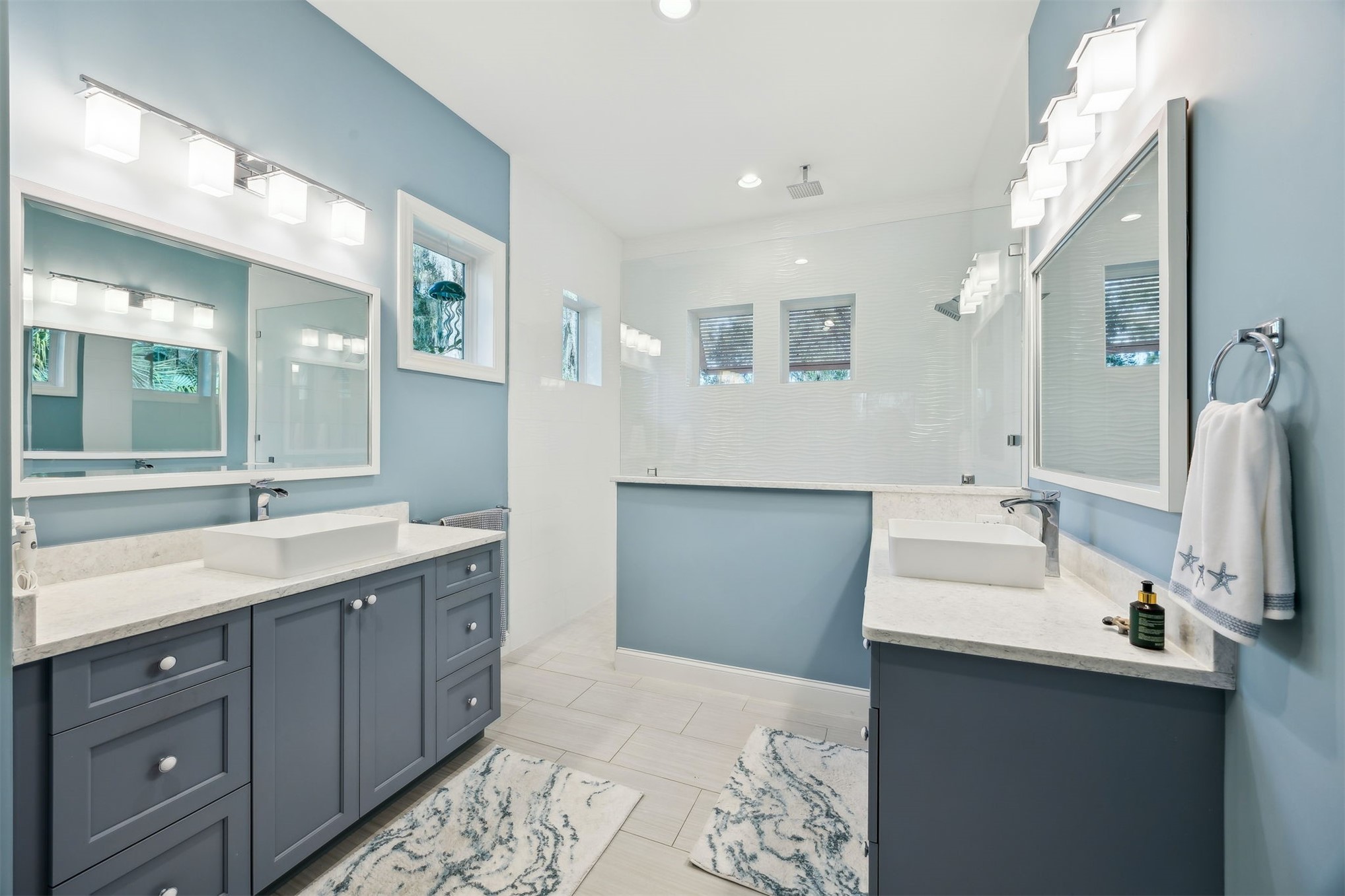 96029 Brady Point Road Fernandina Beach, FL 32034 - Photo 22 of 61 a spacious bathroom with a double vanity sink mirror and