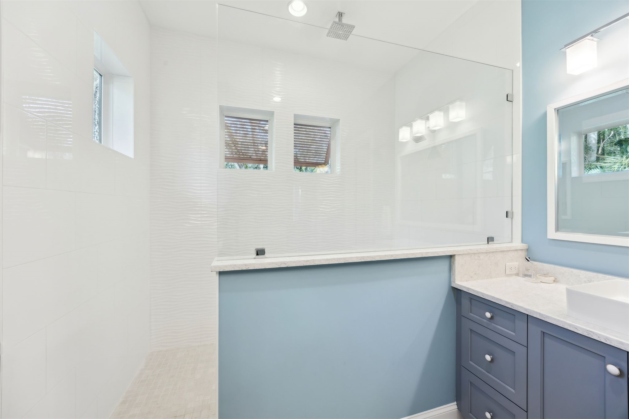 96029 Brady Point Road Fernandina Beach, FL 32034 - Photo 23 of 61 a bathroom with a sink and a mirror