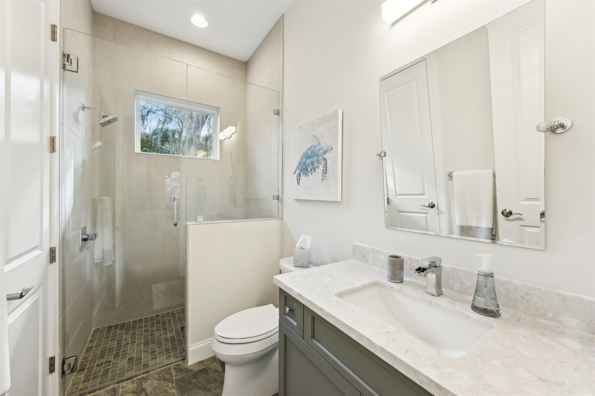 96029 Brady Point Road Fernandina Beach, FL 32034 - Photo 27 of 61 a bathroom with a granite countertop sink toilet and shower