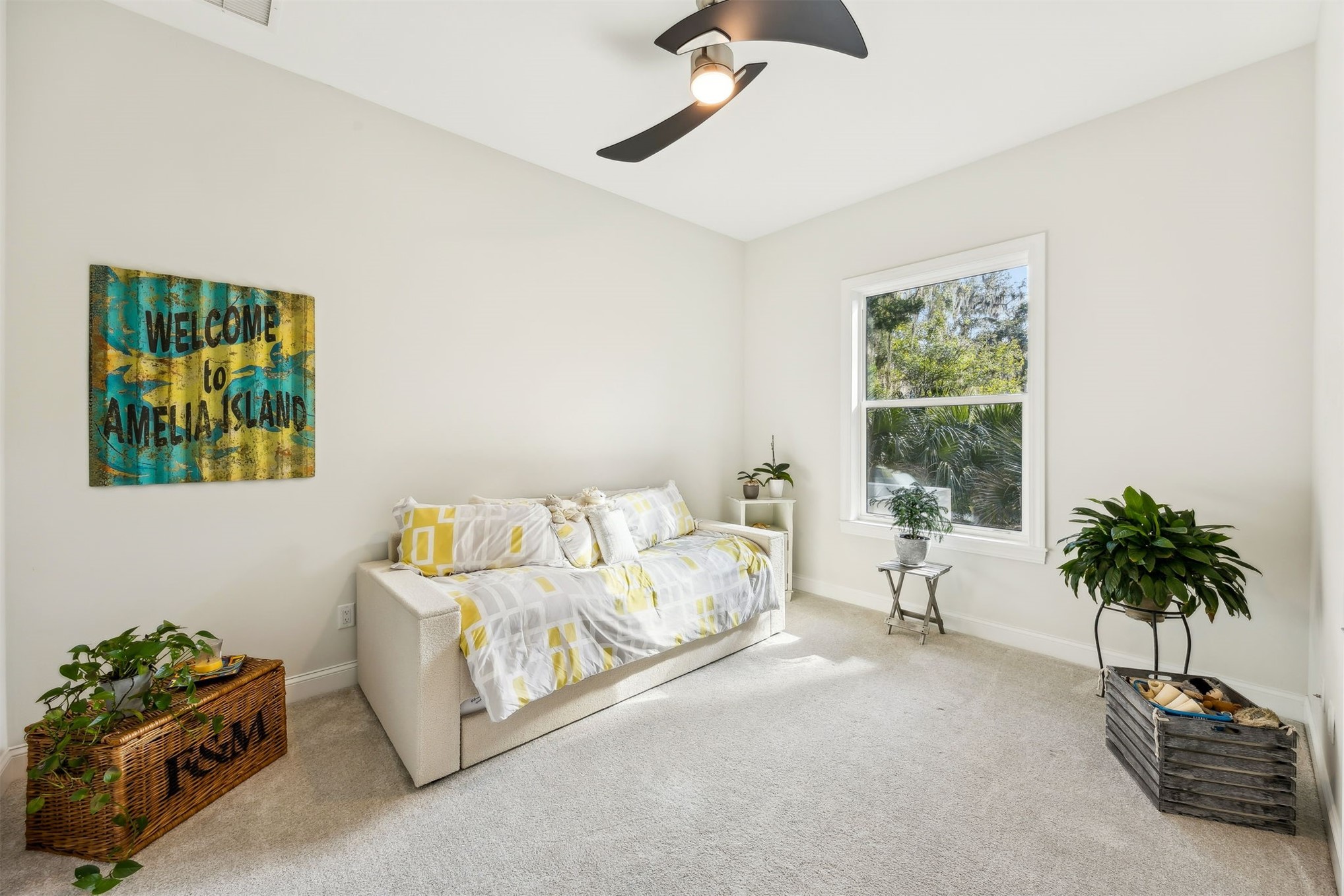 96029 Brady Point Road Fernandina Beach, FL 32034 - Photo 28 of 61 a bed room with a bed and a potted plant