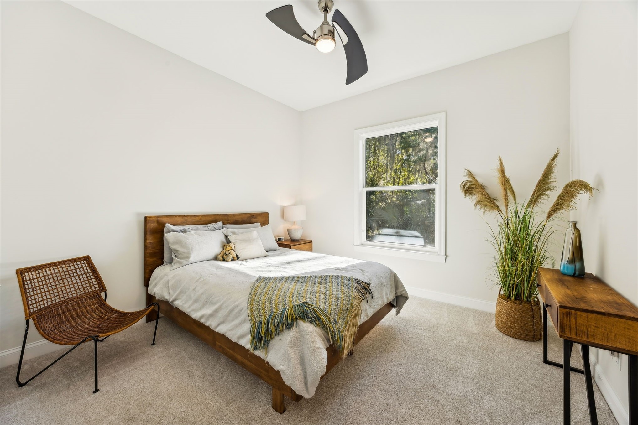96029 Brady Point Road Fernandina Beach, FL 32034 - Photo 29 of 61 a bedroom with a bed chair and window