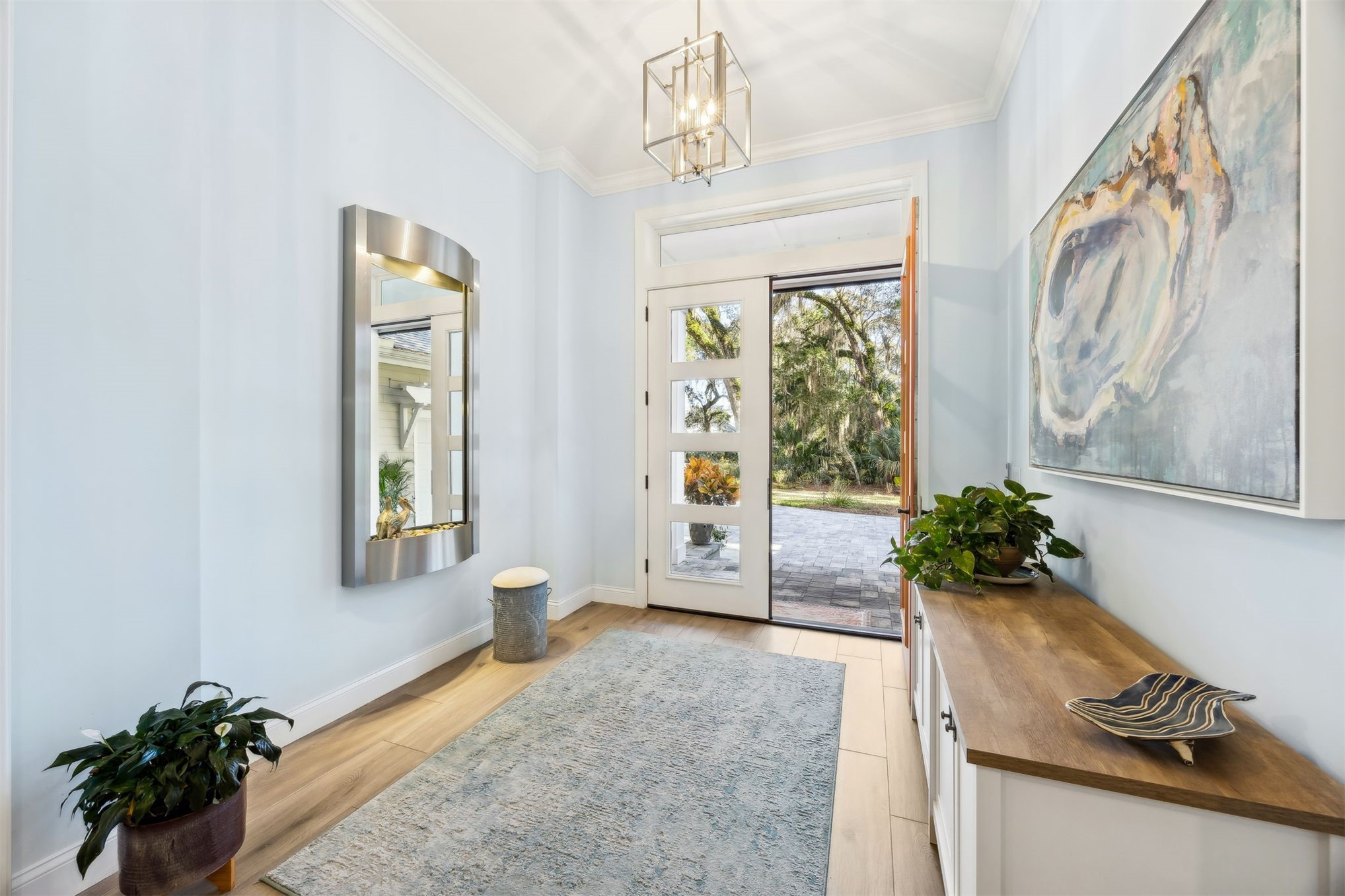 96029 Brady Point Road Fernandina Beach, FL 32034 - Photo 3 of 61 a view of an entryway with wooden floor and front door