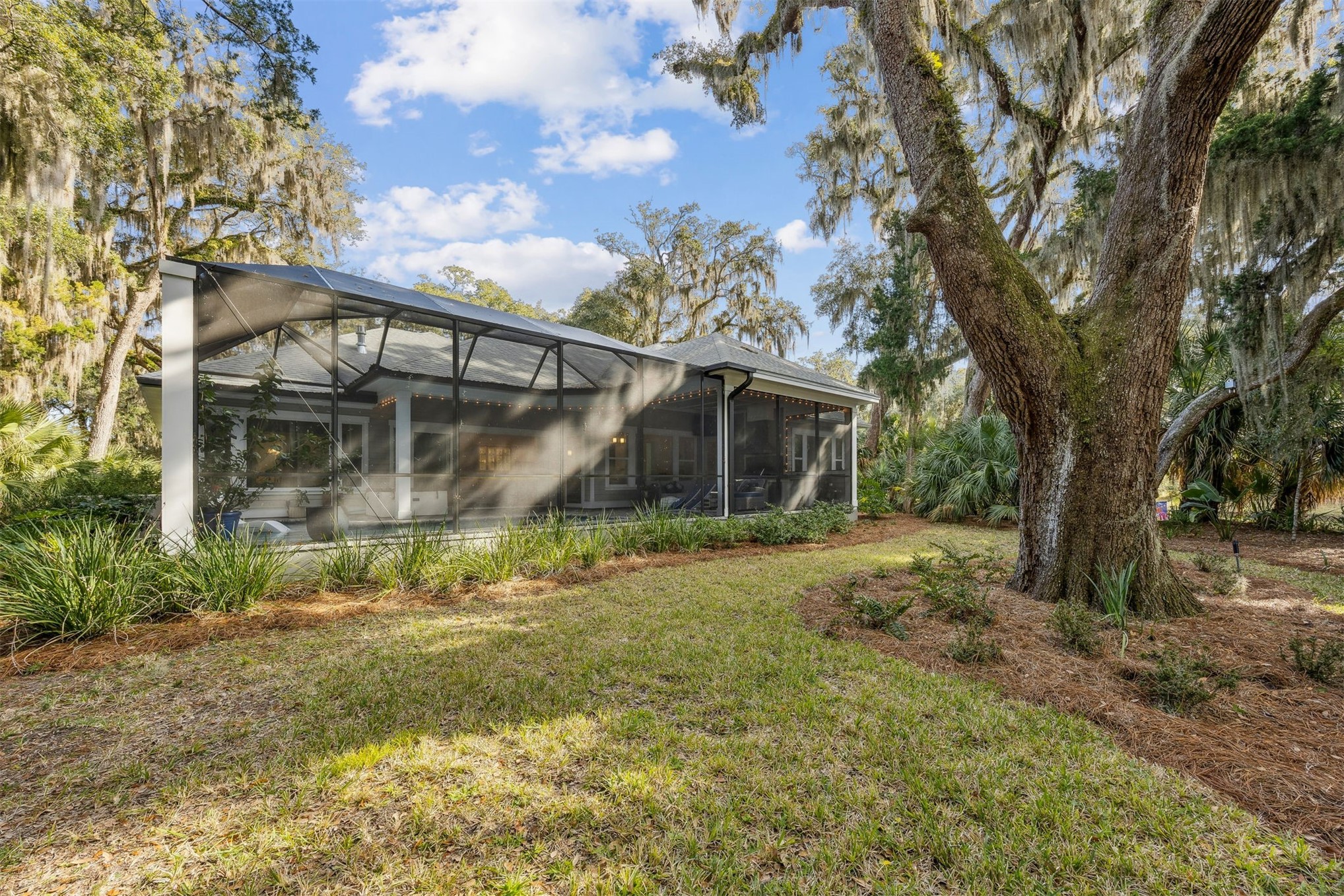 96029 Brady Point Road Fernandina Beach, FL 32034 - Photo 47 of 61 a view of a house with a yard