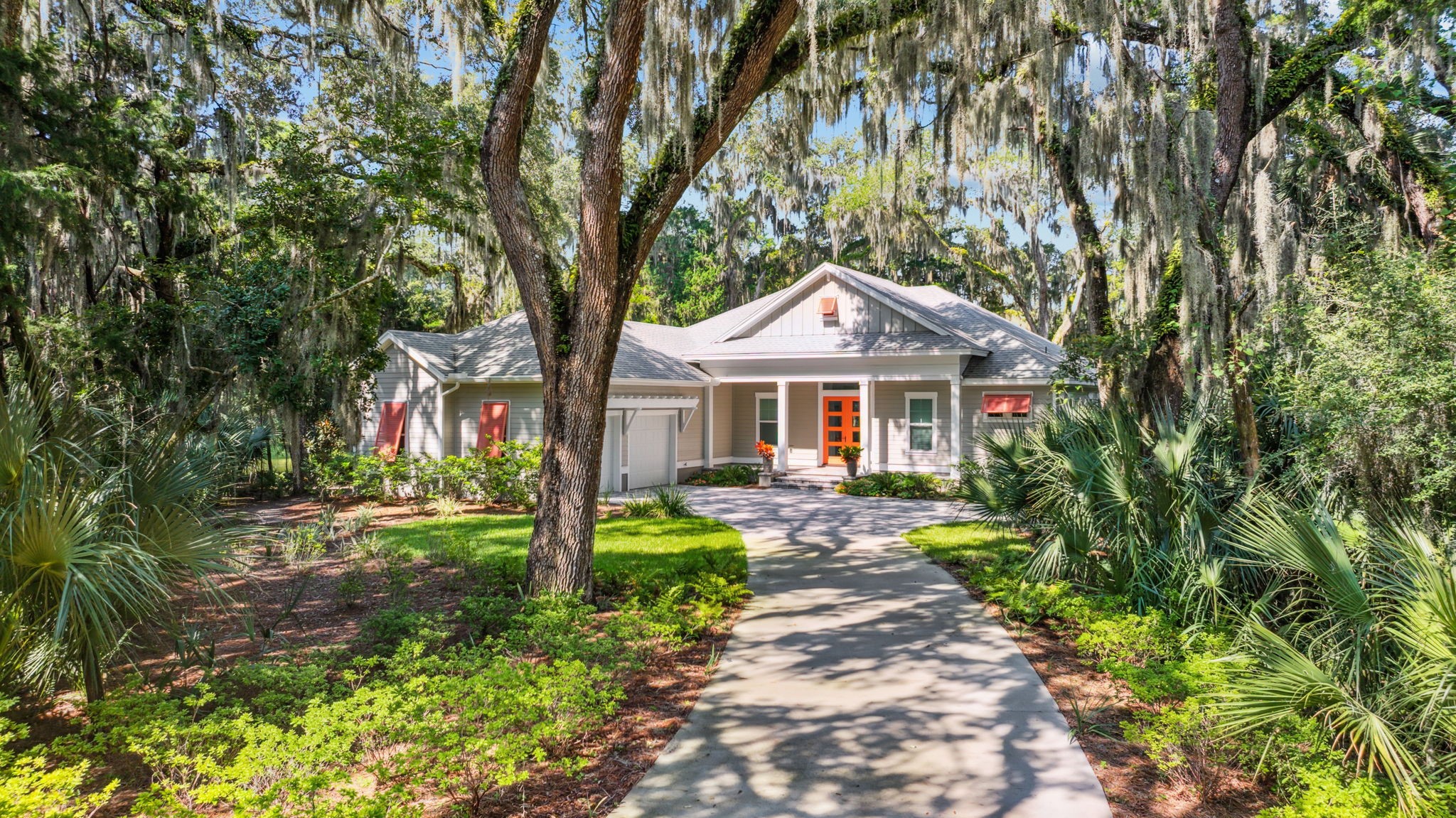 96029 Brady Point Road Fernandina Beach, FL 32034 - Photo 50 of 61 a front view of a house with garden