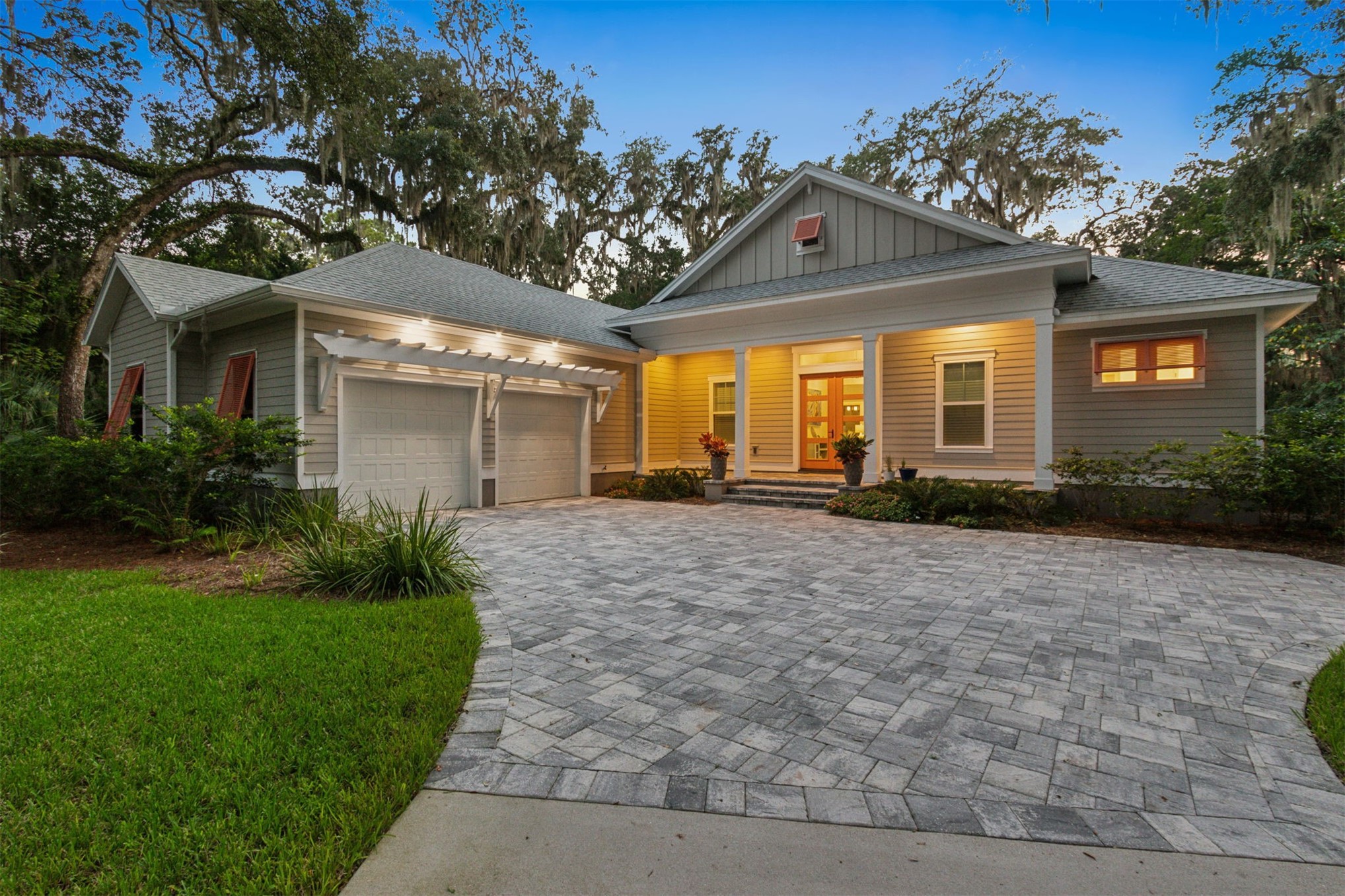 96029 Brady Point Road Fernandina Beach, FL 32034 - Photo 51 of 61 a front view of a house with a yard and trees